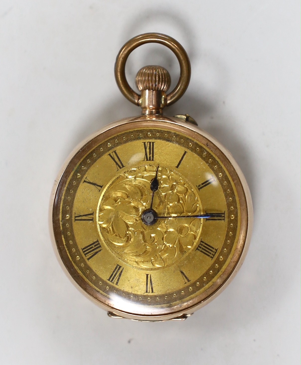 An engraved 9k open face keyless fob watch, with gilt metal inner cuvette, cased diameter 35mm, gross weight 34.6 grams.
